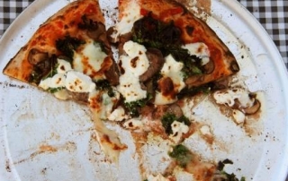 Two slices of wood-fired pizza